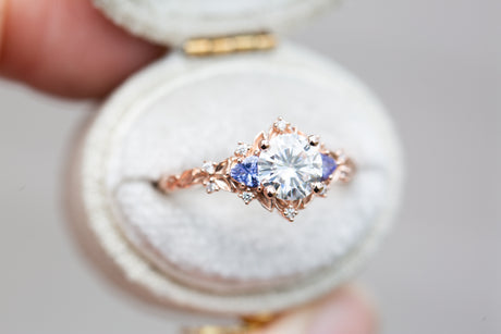 Briar rose three stone with round moissanite and tanzanite