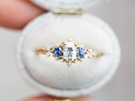 Briar rose three stone with oval moissanite and blue sapphire