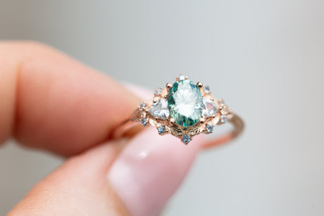 Woodland three stone with teal moissanite and aqua accents