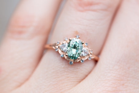 Woodland three stone with teal moissanite and aqua accents