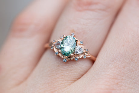 Woodland three stone with teal moissanite and aqua accents