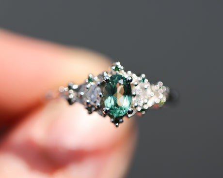 Briar rose three stone with oval lab green sapphire and green diamond accents