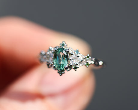 Briar rose three stone with oval lab green sapphire and green diamond accents