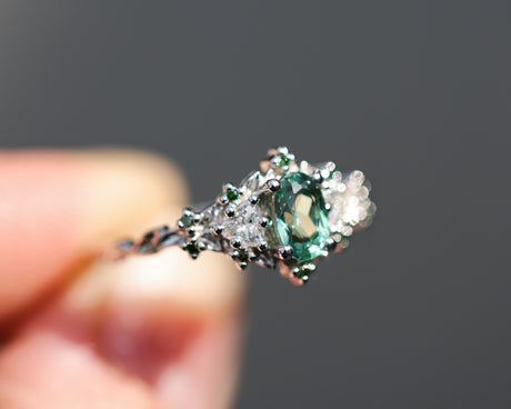 Briar rose three stone with oval lab green sapphire and green diamond accents