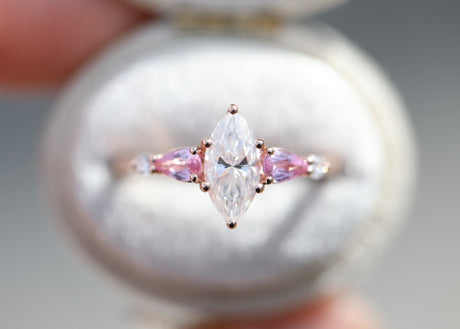 Five stone lattice setting with marquise moissanite and pink sapphire