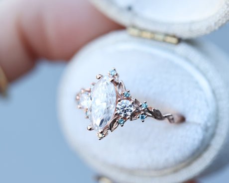Briar rose three stone with marquise 10x5mm moissanite and aqua diamonds