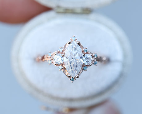 Briar rose three stone with marquise 10x5mm moissanite and aqua diamonds