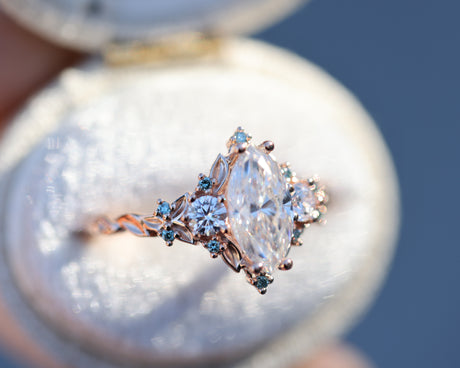 Briar rose three stone with marquise 10x5mm moissanite and aqua diamonds