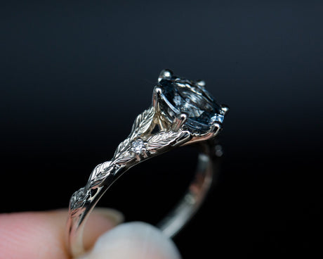 Oval grey spinel leaf ring