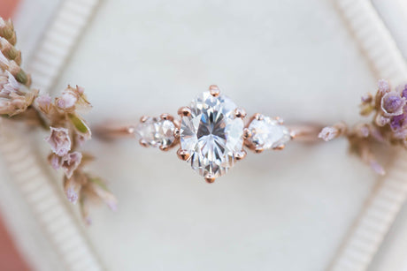 Oval moissanite three stone engagement ring, pear side stone